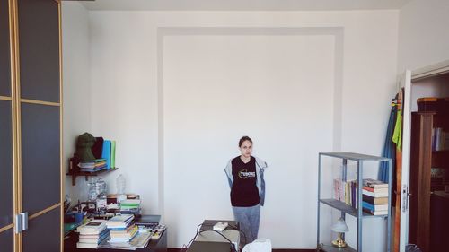 Woman standing in corridor