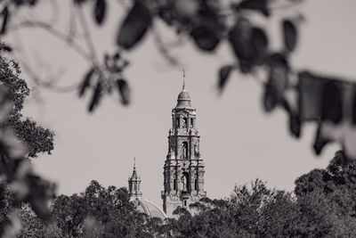 Low angle view of bell tower against sky