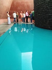 High angle view of people standing by railing