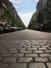 View of street in city against sky