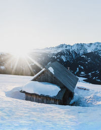 Scenic view of snow covered mountains against clear sky