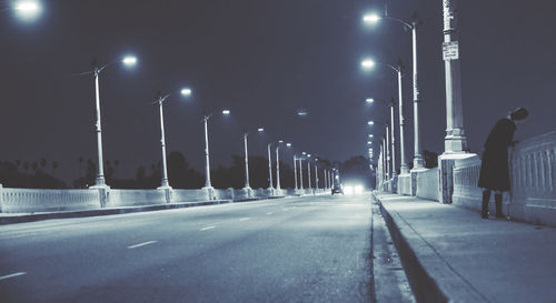 Illuminated street lights at night