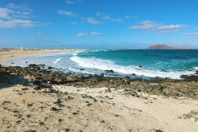 Scenic view of beach against sky