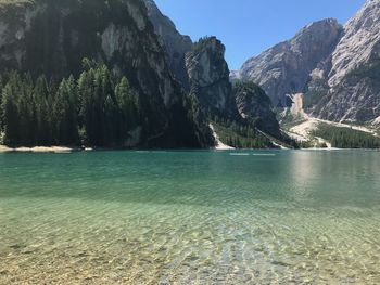 Scenic view of sea and mountains against sky