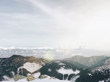 Scenic view of snowcapped mountains against sky