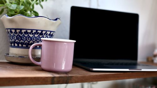 Close-up of coffee cup on table