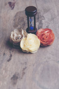 High angle view of roses in glass on table