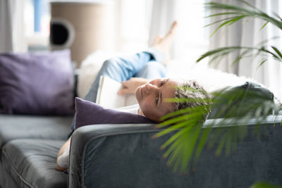 Young woman sleeping on bed at home