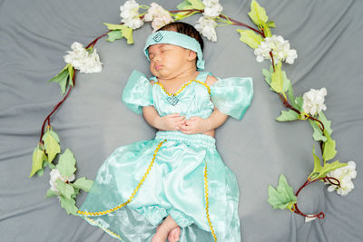 High angle view of cute girl with bouquet