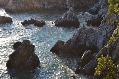 High angle view of rocks on sea