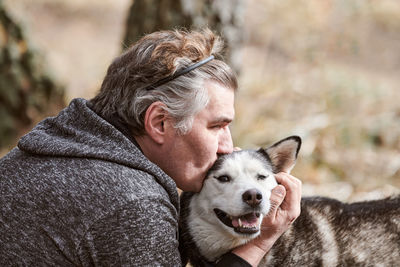 Portrait of young man with dog