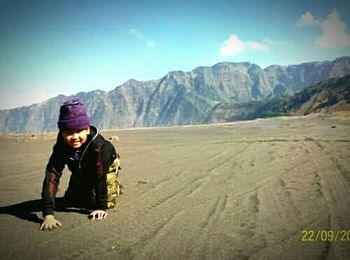 Woman standing on mountain landscape