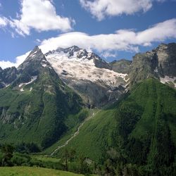 Scenic view of landscape and mountains against sky