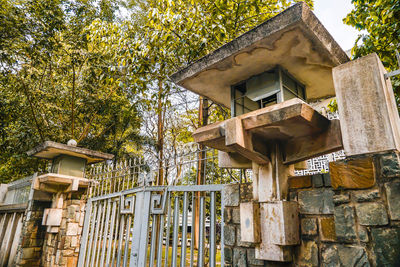 Low angle view of birdhouse against building