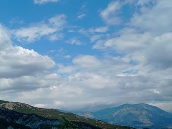 View of mountain range against cloudy sky