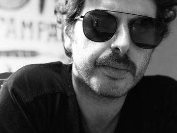 Close-up portrait of man wearing sunglasses