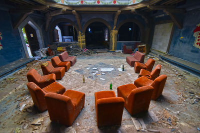 High angle view of messy table in abandoned building