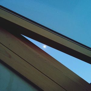Low angle view of built structure against clear blue sky