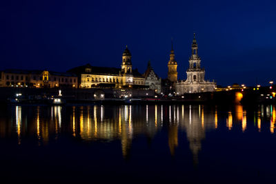 Reflection of illuminated buildings in water