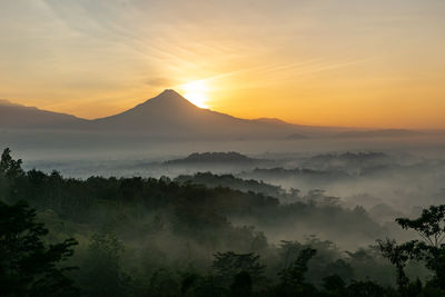 Scenic view of mountains against sky during sunset