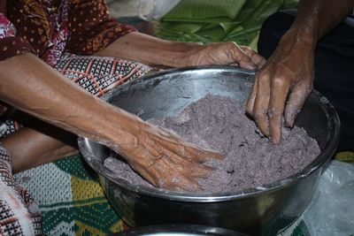 Midsection of woman working in container