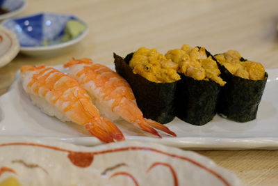 Close-up of sushi served on table