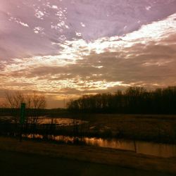 Scenic view of lake at sunset