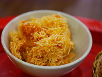 Selective focus of thai sweeten crispy noodles, mee krob, northern thai snack served in a bowl