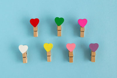 Directly above shot of multi colored heart shape on white background