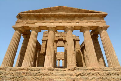 Low angle view of old temple against clear sky