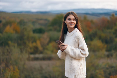 Young woman using mobile phone