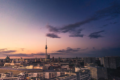 Communications tower amidst city buildings