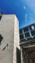 Low angle view of building against blue sky