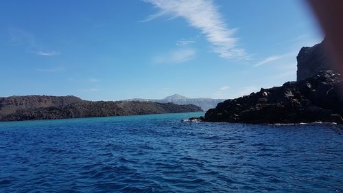 Scenic view of sea against blue sky