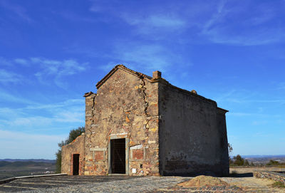 Low angle view of old building against sky