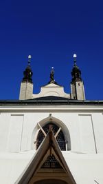 Low angle view of cathedral against clear blue sky