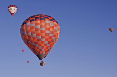 Low angle view of hot air balloon against clear sky