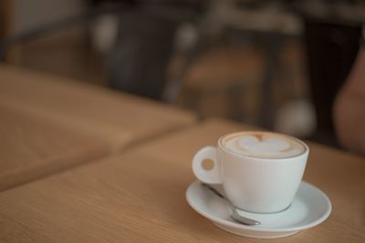 Close-up of coffee cup on table