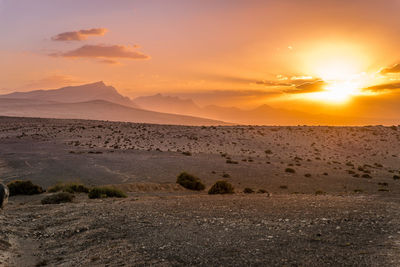 Scenic view of landscape against sky during sunset