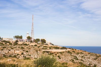 Panoramic shot of building by sea against sky
