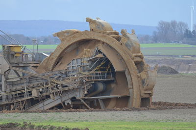 Old train on field against sky