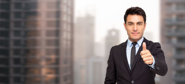 Portrait of young man standing outdoors