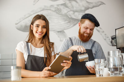 Young couple holding ice cream