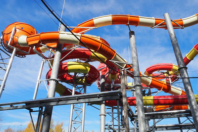 Bright colored water slides in the water park against the blue sky. high quality photo