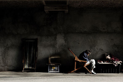 Young woman sitting on floor