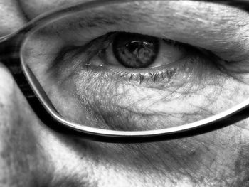 Cropped image of person wearing eyeglasses