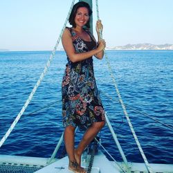 Portrait of smiling young woman in sea