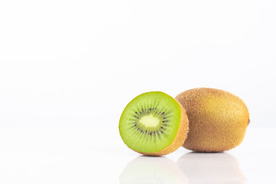 Close-up of oranges against white background