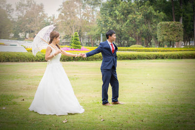 Couple standing in park