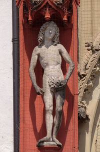 Statue of buddha against building